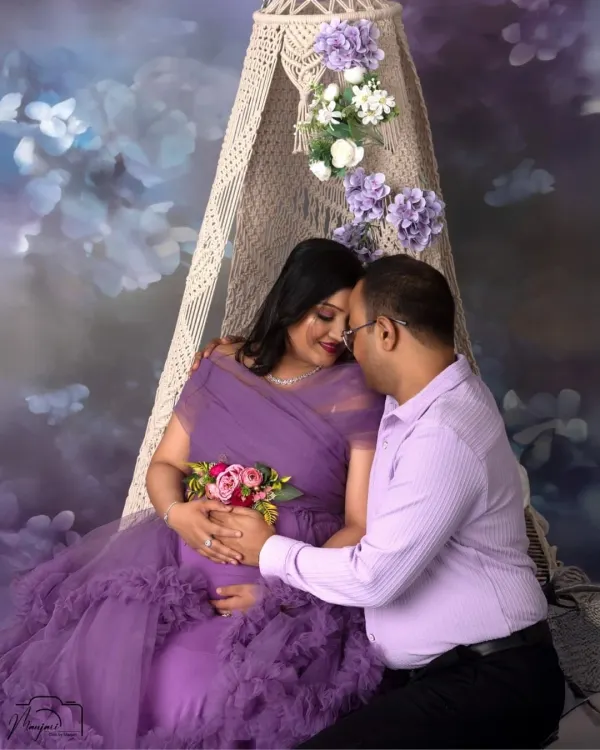 A fairytale moment on our new macrame swing setup. This couple shares a tender embrace, surrounded by a dreamy, lavender-themed floral backdrop.