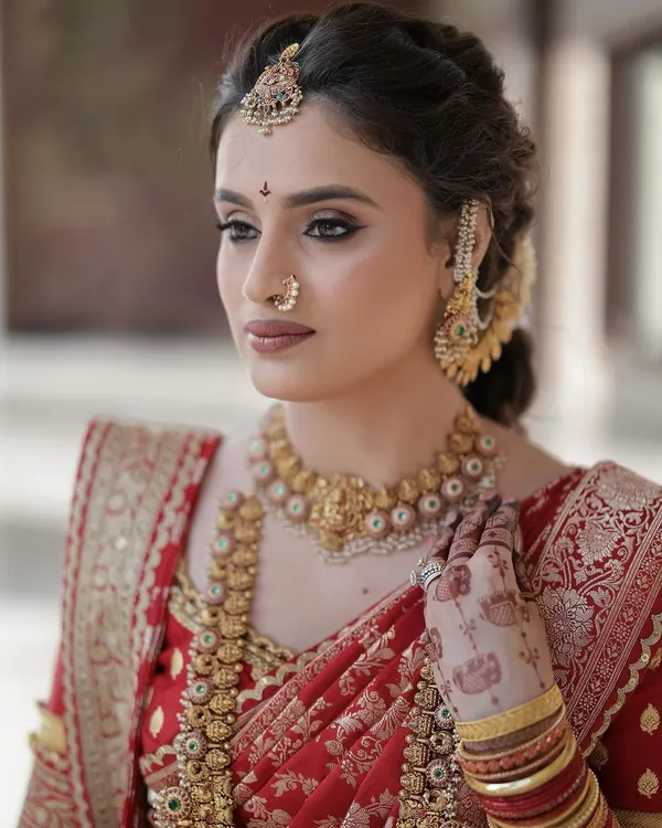 A close up of my beautiful bride Daneshwari. Her look features classic winged eyeliner and soft contouring to define her features, paired with traditional gold jewellery for a truly royal feel.