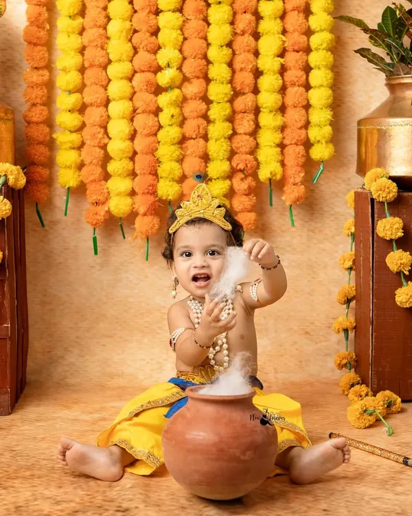 The classic 'Makhan Chor' moment. We use safe, dry ice to create a magical smoke effect from the butter pot, resulting in a playful and divine portrait.