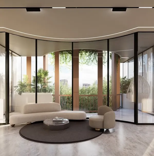 A rendering of the Amara Avika luxury residences in Chennai. The design features a curved glass facade that separates public and private zones, creating a transparent and seamless connection with the leafy Poes Garden neighborhood.