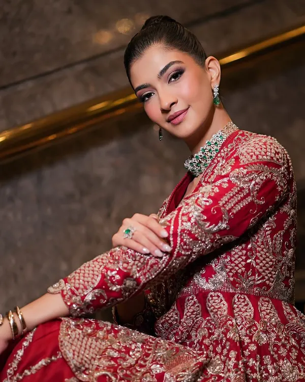 A beautiful portrait showcasing a soft glam look on my muse Hanna. The makeup features a clean, elegant updo and a defined eye, perfect for complementing her red Jayanti Reddy outfit.