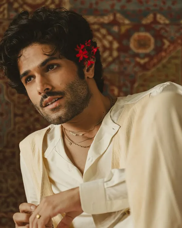 A collaboration where music, acting, and fashion merge. This layered white ensemble, crafted by us, was designed for a poetic visual reimagining of a timeless ghazal.