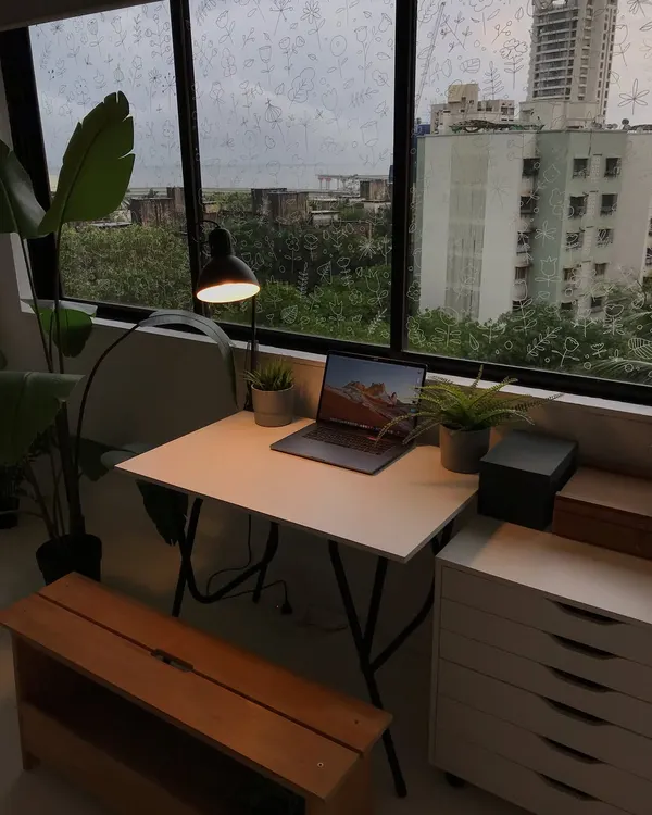 A view of my workspace on a rainy day. My desk is where I do all of my digital work, with my laptop and drawing tablet ready to go.