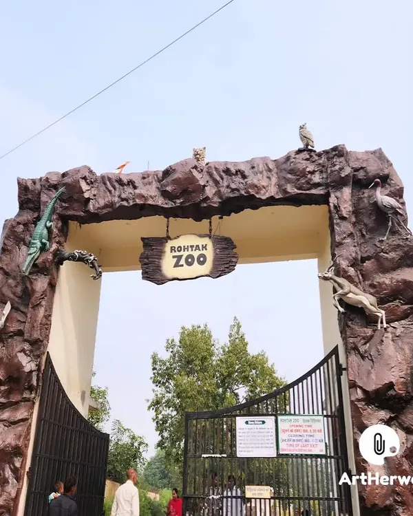 A full view of the Rohtak Zoo entrance gate we constructed. The design incorporates various animal sculptures, such as a crocodile and antelope, directly into the rock-like structure.