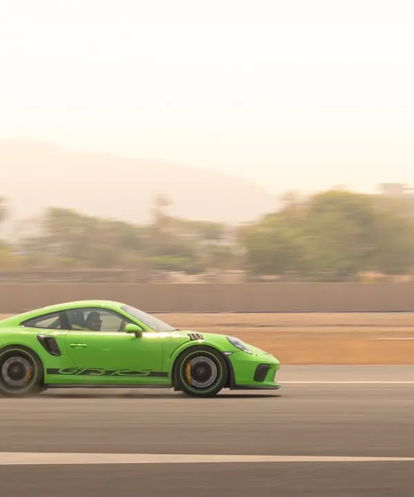 I specialize in capturing the essence of speed, as seen with this Porsche GT3 RS in a full-speed panning shot that blurs the background to emphasize its motion.