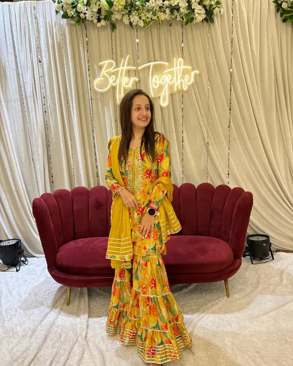 Dressed up for a wedding function. I love the elegance and vibrant colors of traditional Indian wear, and this yellow sharara set was perfect for the celebration.