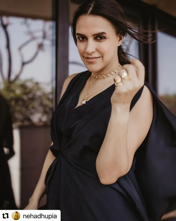 A candid shot of Neha Dhupia, showcasing the simple, textured ponytail I styled for her. It's a chic and modern look that is perfect for a public appearance.