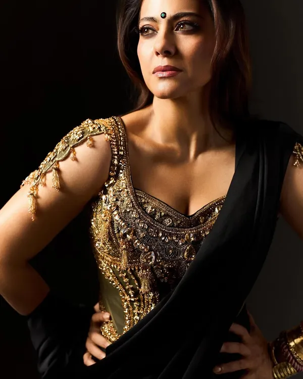 A close-up of the custom gold corset blouse created for Kajol's character in 'Maa'. The intricate detailing and shoulder adornments were designed to resemble armor, symbolizing her role as a protector. It's a piece that is part jewelry, part power statement.
