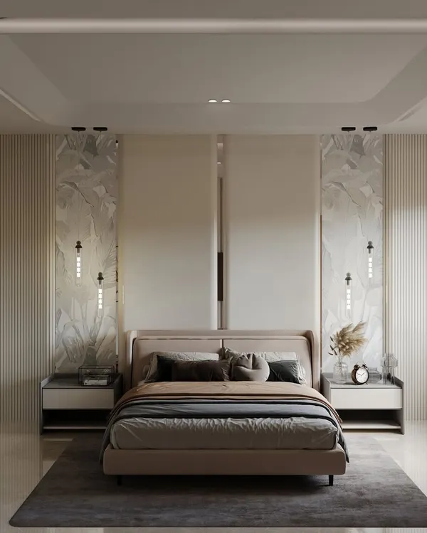 This master bedroom is a study in symmetry and tranquility. The bed is flanked by two large marble panels with integrated wall sconces, while a coffered ceiling with ambient lighting adds a sense of height and grandeur to the restful space.