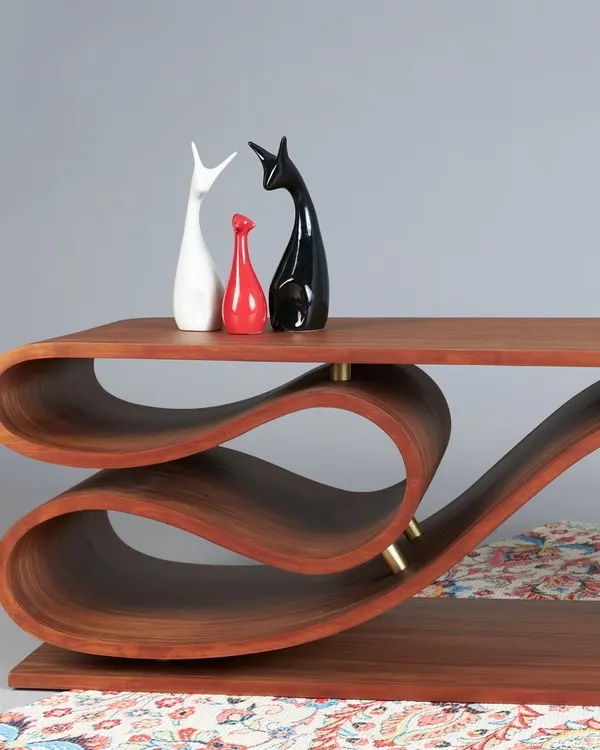 The SWISH bench is our contemporary take on seating, crafted from flexible plywood. Inspired by the fluidity of running water, its elongated, curved sheets create a dynamic and organic form that is both a bench and a sculpture.
