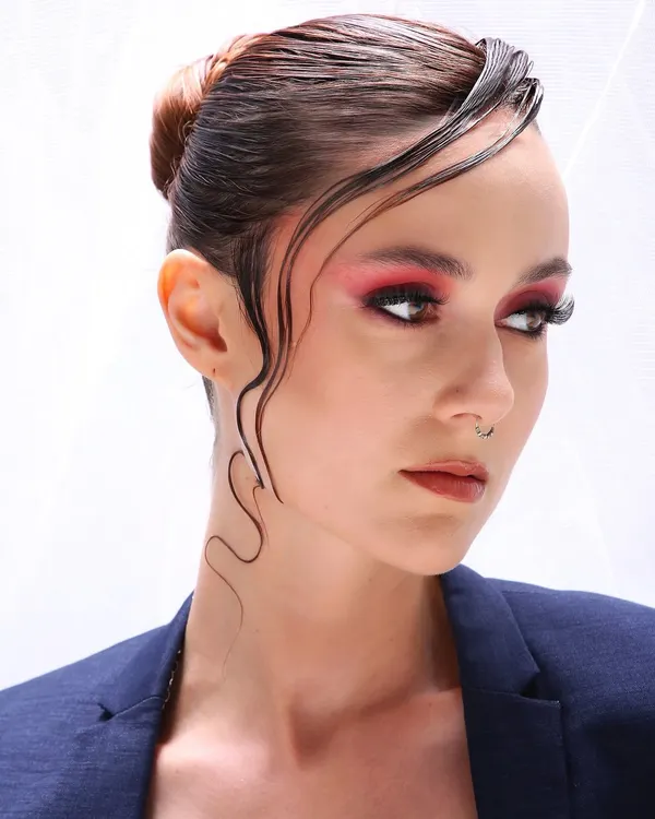 This is the kind of high-fashion editorial look I love to create. It's all about making a statement with bold color, sharp details, and a flawless skin finish that looks incredible on camera.