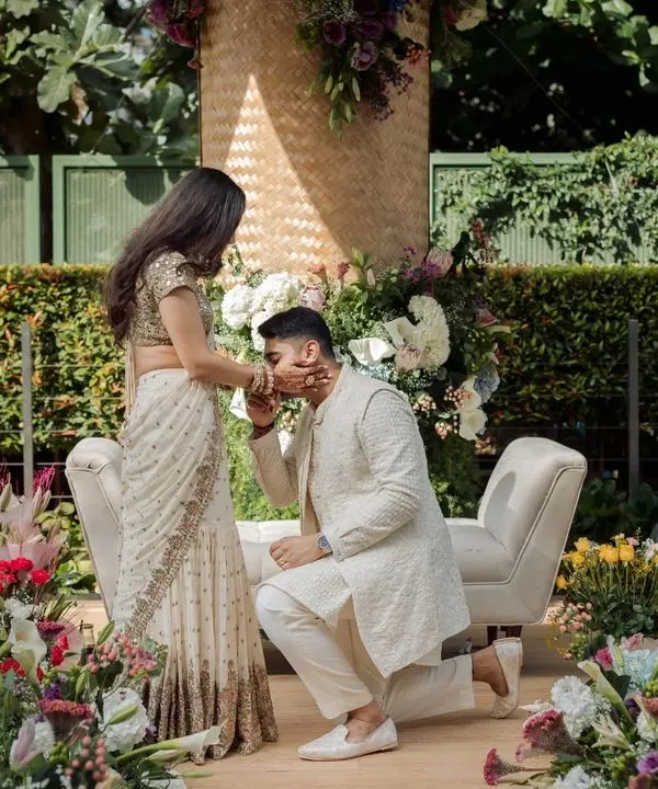 A beautiful, tender moment from an engagement ceremony we designed. The decor was not only beautiful but also sustainable, with a hand-woven backdrop and locally sourced flowers, creating a truly mindful celebration.