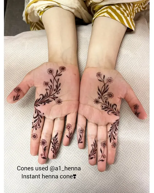 A beautiful example of a minimalist design using my instant henna cones. The delicate floral vine flows gracefully from the palm to the fingers.