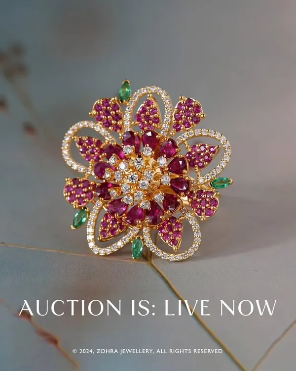 The 'Fluttering Whisper' ring, the showstopper of my recent auction. This magnificent floral design is crafted in 18k gold and features exquisite Mozambique rubies, pristine Zambian emeralds, and radiant premium diamonds. It is a testament to what is possible with bespoke design.