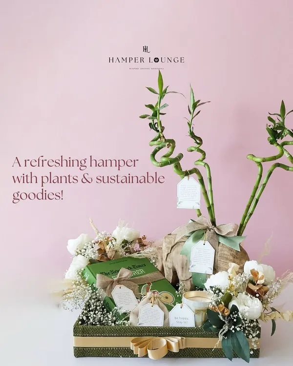 A refreshing hamper with plants and sustainable goodies. This gift is a breath of fresh air, featuring a lucky bamboo plant, eco-friendly treats, and jute-crafted bags for a touch of natural elegance.