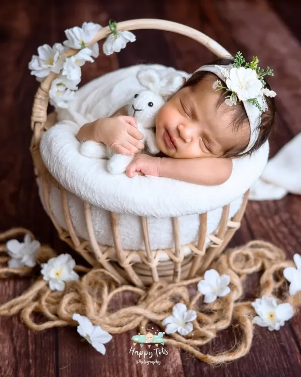 This peaceful pose took a lot of patience, but it was so worth it. We gently guide babies into comfortable positions, like this sweet head-on-hands pose in a rustic basket.
