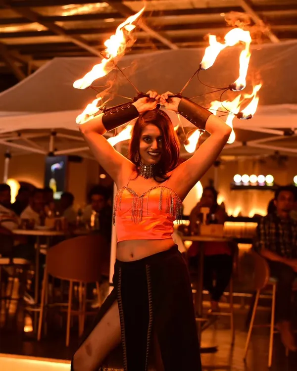 A fiery moment from an Oktoberfest celebration. Using fire fans allows me to get close to the audience and share the warmth and energy of the performance.