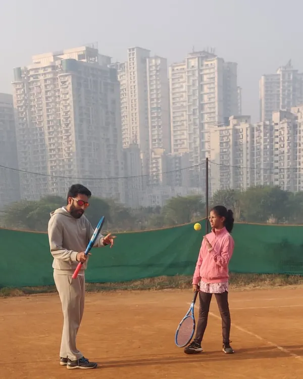Personal attention is key to development. Here I am on the clay court giving one on one instruction to our nationally ranked player, Kavya, focusing on her ball contact and racket preparation.