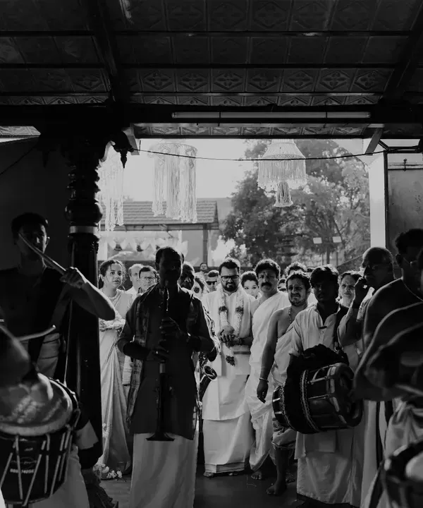 An artistic shot from a temple performance, capturing the timeless atmosphere of a traditional Chendamelam procession.