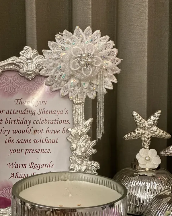 An evening of light and fragrance. Our handcrafted hampers are more than gifts, they are experiences, featuring beautiful decor pieces like this lace flower and scented candle.