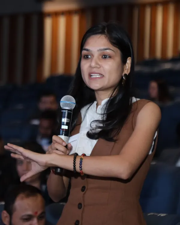 Here I am speaking at a business event, sharing my story of transitioning from a career in dentistry to becoming a full-time artist. It's a journey of following passion over a conventional path.
