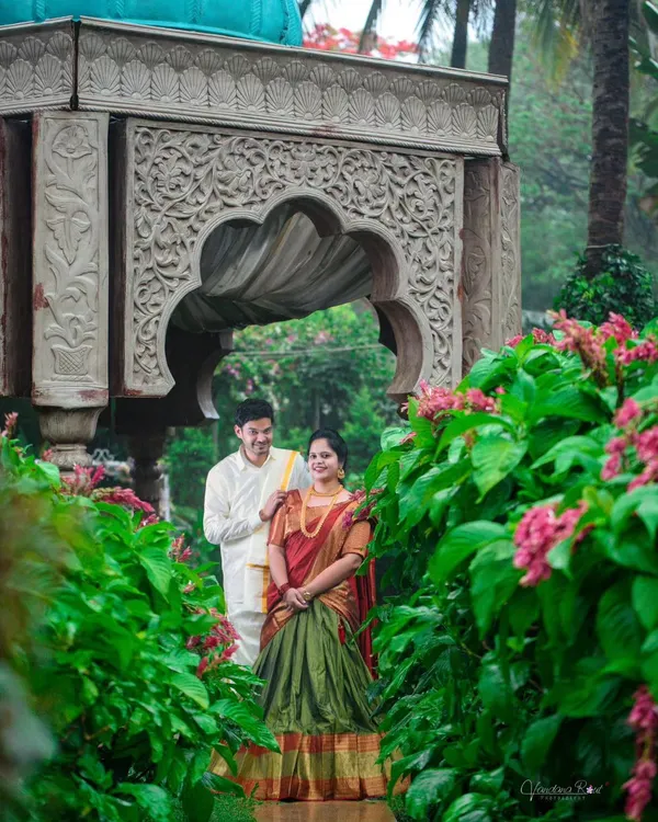 A beautiful pre-wedding shoot at Elements Bangalore, where the couple's traditional South Indian attire is perfectly framed by lush greenery and classic architecture.