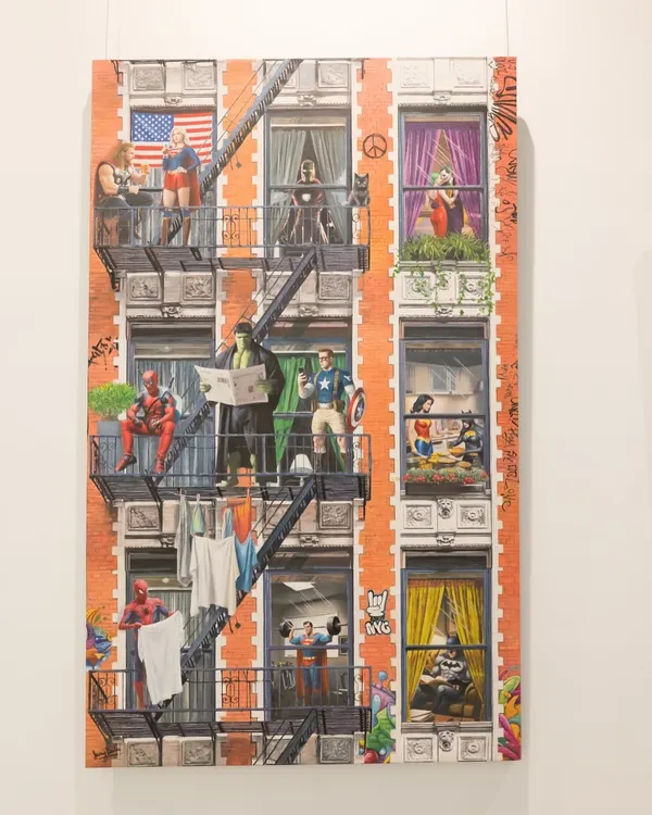 "Ordinary Powers" transforms a city building into a tableau of superhero life. This full view shows characters like Spider-Man, Thor, and Wonder Woman blending the extraordinary with the everyday.
