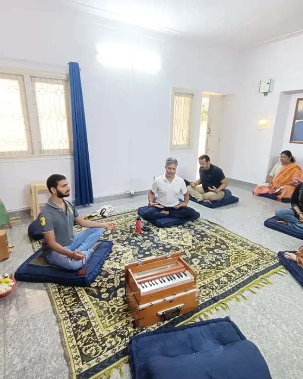 Welcome to our Sunday Satsang, a morning of peace and spiritual renewal. Here, we gather as a community for quiet meditation, listen to uplifting chants led with the harmonium, and share in the wisdom of our gurus, all centered around a beautifully prepared altar.
