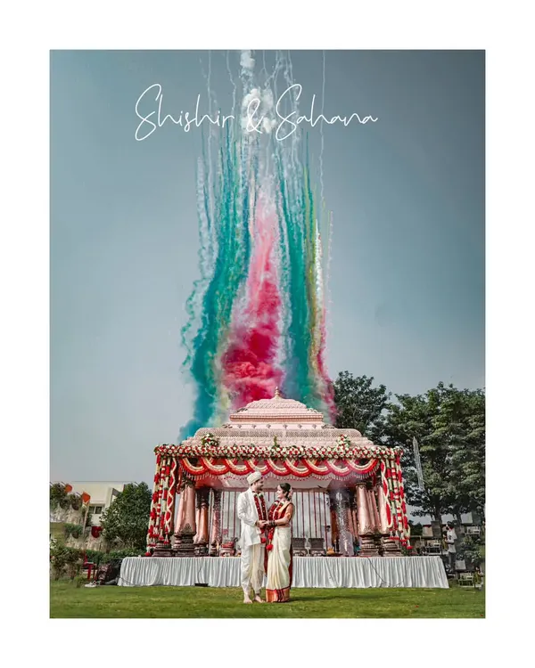 This is what a fairytale moment looks like. We love creating grand, vibrant, and unforgettable shots like this one at Shishir and Sahana's Hubli wedding, using colored smoke to add a touch of magic to their celebration.