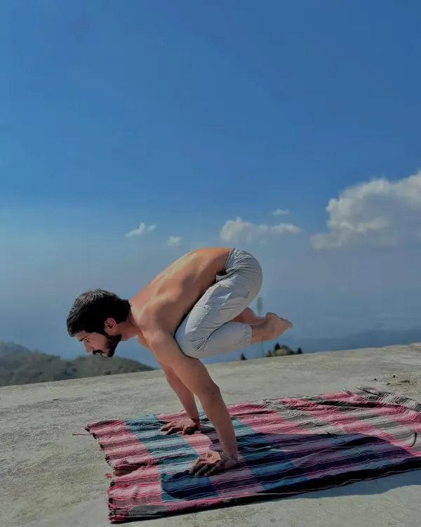My personal practice, like this Bakasana (Crane Pose) in the mountains, is my foundation. It connects me to the principles of balance, strength, and mindfulness.