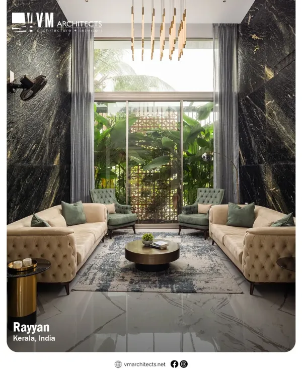 The formal living room at Rayyan, featuring tufted sofas, a dramatic marble wall, and a double-height window that looks out onto a green space.