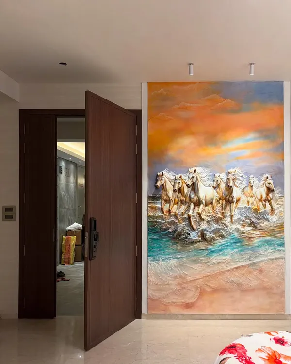This large, colorful 7 horses mural is installed in a bedroom, creating a stunning feature wall. The artwork's energy and vibrant sunset colors make the room feel expansive and powerful.