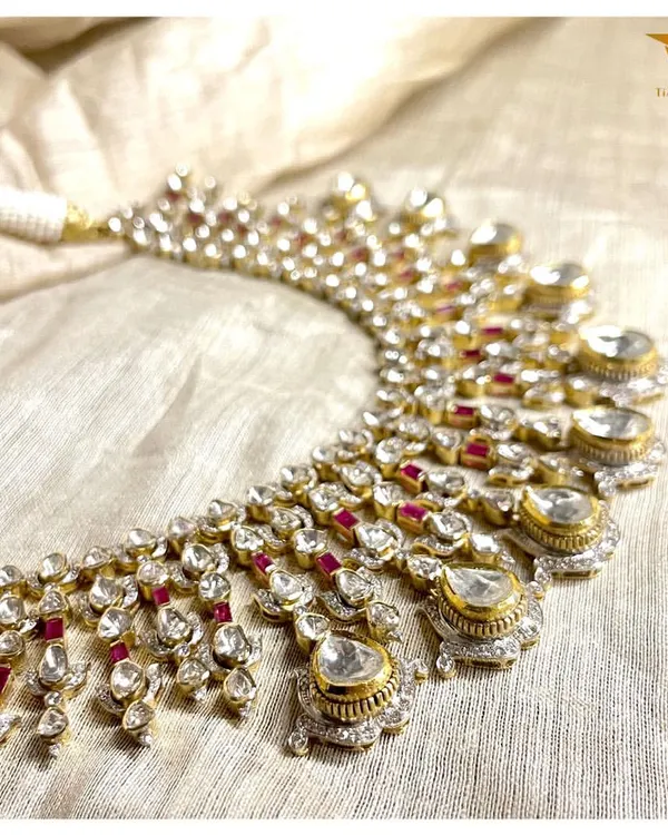 Every detail of this polki necklace is a work of art. A symphony of uncut diamonds and rubies, this piece is a celebration of light, color, and traditional craftsmanship.
