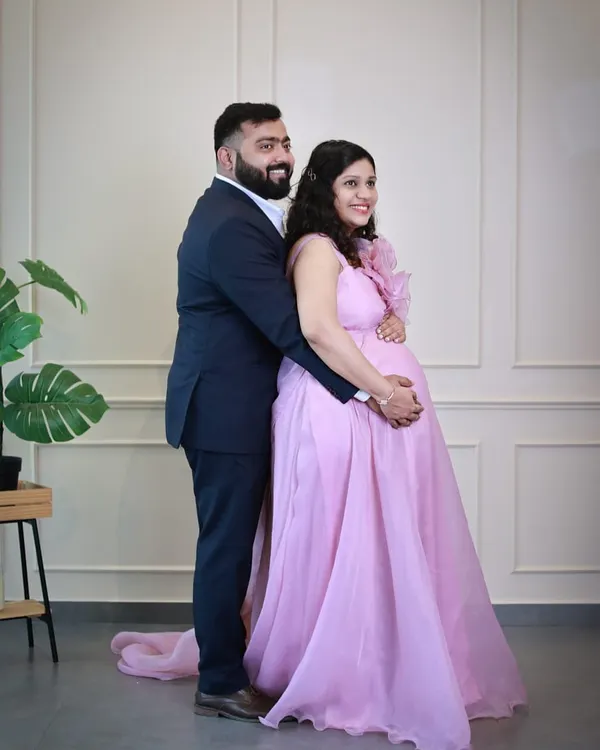 Our lavender organza gown is pure romance. It features a large, handcrafted statement flower on the shoulder and a light, airy skirt that flows beautifully.