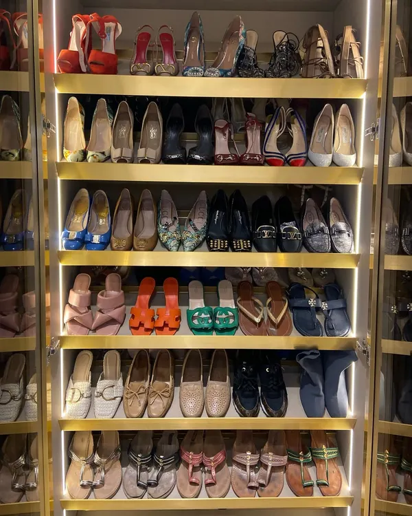 A shoe collection transformed into a work of art. With integrated lighting and ample shelving, every pair is on display, making it easy to find the perfect match for any outfit. This is what a shoe lover's dream looks like.