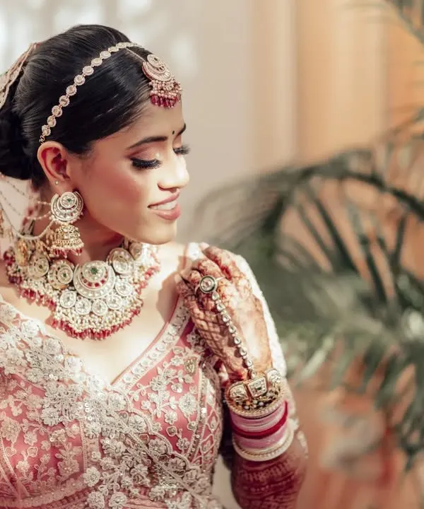 A detailed portrait of the bride, Nupur. I focused on her intricate jewelry and the delicate embroidery of her lehenga, capturing the artistry of her bridal look.