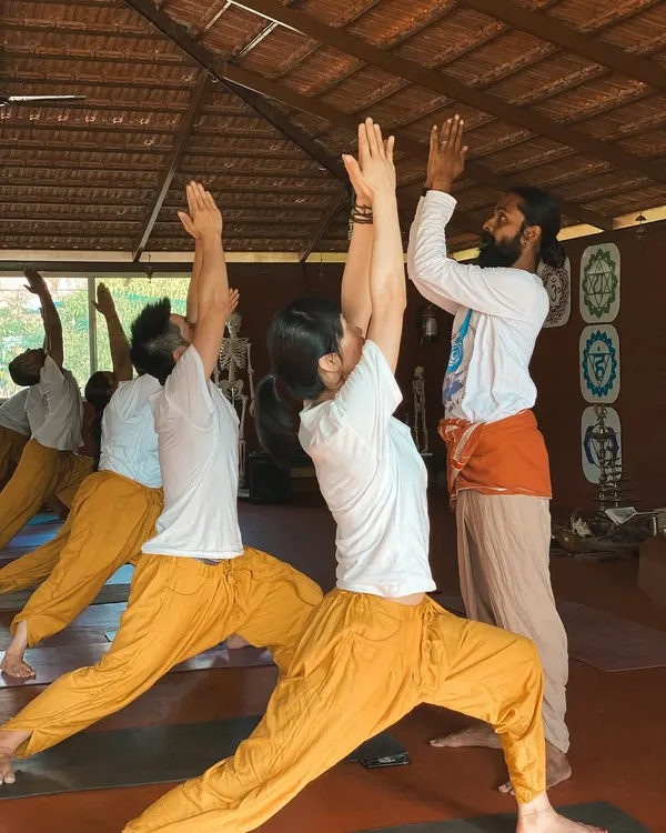 In Virabhadrasana I (Warrior I Pose), the goal is not just the shape but the feeling of strength and stability. I guide students to lift their hearts and ground through their feet, finding the balance between effort and ease. This is how we build a strong, intelligent practice.