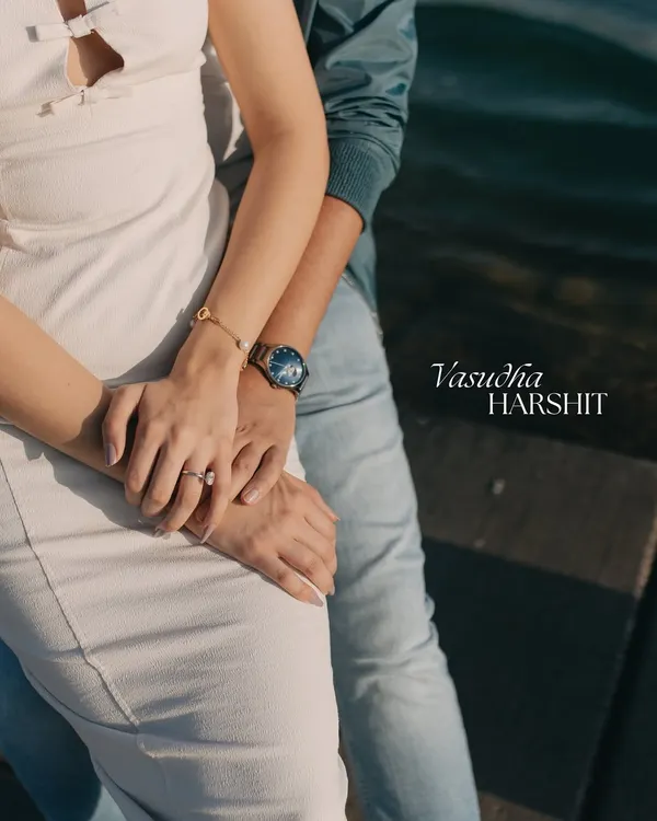 A pre-wedding shoot is about capturing the beginning of your forever. This close-up on the couple's hands, set against the stunning backdrop of Qatar, symbolizes their new journey and intertwined lives.