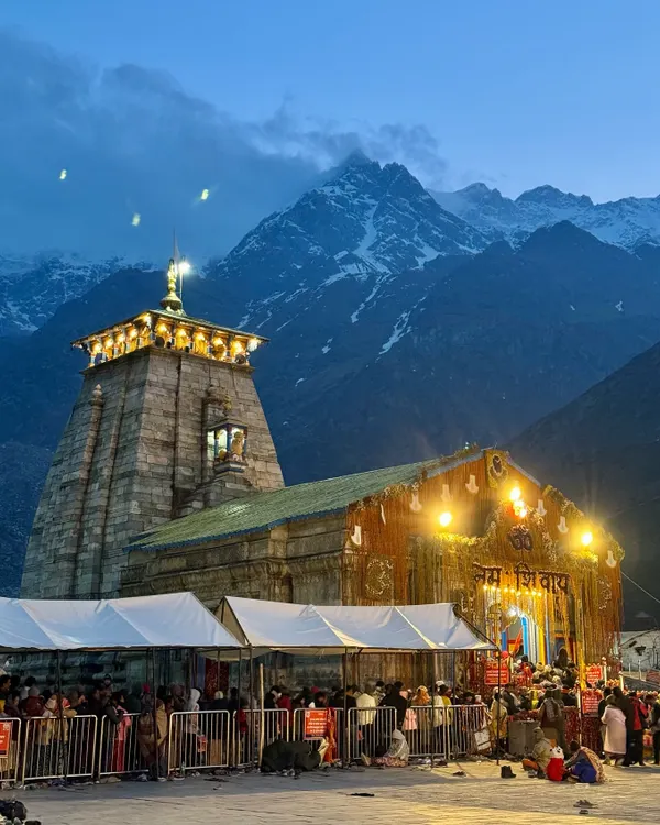 The divine glow of the Kedarnath temple at night, set against the majestic, snow-covered Himalayas. This is the moment of peace and awe that every pilgrim dreams of, a sight that makes the entire journey worthwhile.