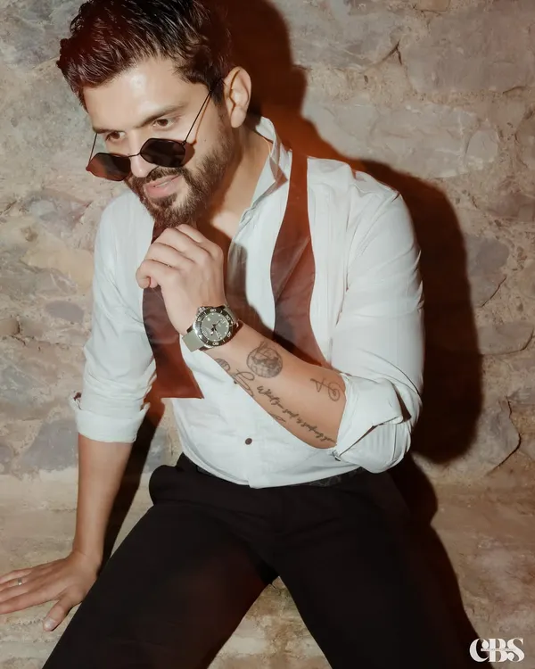 A stylish look for an evening event, featuring a white shirt and a bow tie. Ready to shine bright and bring the energy.