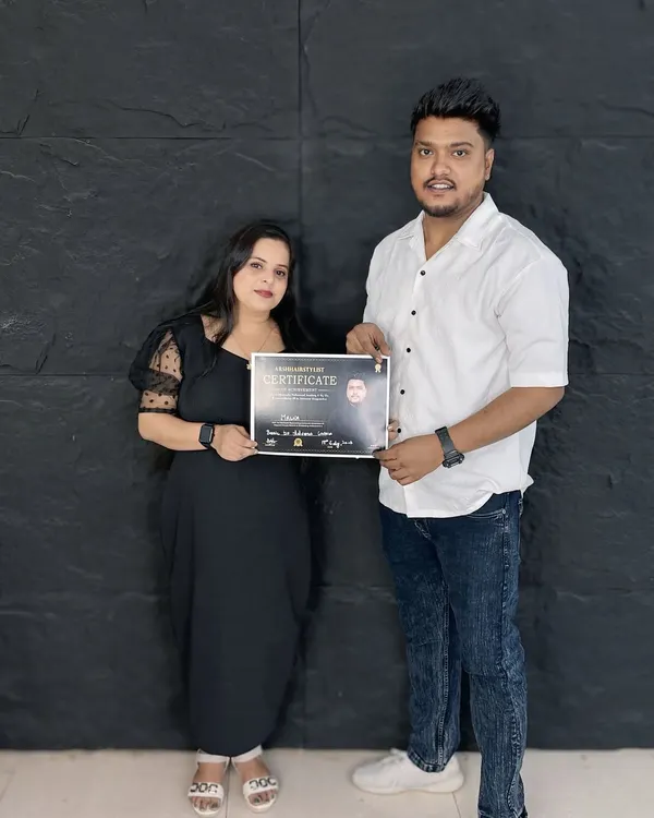 Another happy student receiving her certificate after completing the hairstyling course. It's so rewarding to see my students ready to take on the world.