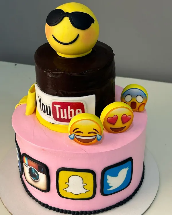 A fun, two-tier social media themed truffle cake for a digital marketing company's anniversary. This shows how I can tailor designs to match a company's brand and industry.