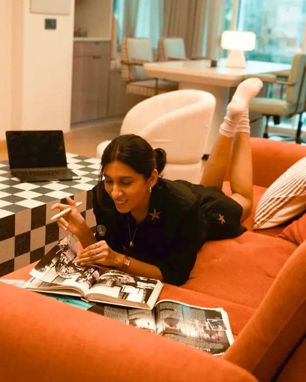 A typical day at the studio isn't always glamorous. It's often just me on the couch with my books and laptop, brainstorming ideas in a comfy outfit.