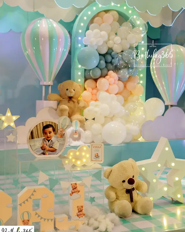 A dreamy hot air balloon and teddy bear theme, perfect for a first birthday. We used a soft, pastel color palette and cloud-like balloon clusters to create a gentle, sky-high celebration.