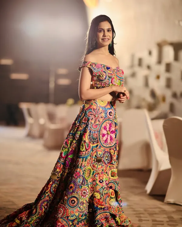 A full view of the stunning and unique multi-colored lehenga by Krupa Jain. This is a perfect example of a statement piece for a vibrant Mehendi or Haldi ceremony.
