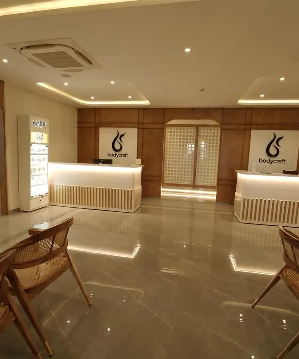 A wider view of our reception and waiting area in Electronic City, Bengaluru. The space is designed to feel open and luxurious, setting the tone for a relaxing and professional experience from the moment you walk in.