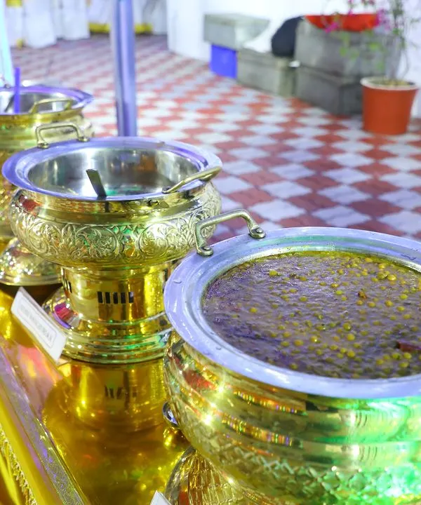 Our dishes are served in beautiful, ornate brass pots that keep the food warm and add a touch of royalty to the buffet line. Here you can see one of our rich, dark gravies.