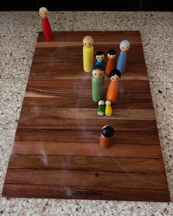 In a typical session, we use a board and figures to represent your family system. This constellation revealed how a client's physical weight was connected to the emotional burden of being the 'giver' in all her relationships, allowing her to release judgments and find peace.