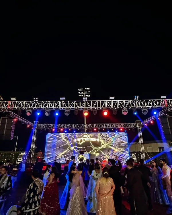 A wide-angle view of the massive stage and lighting rig from a recent wedding. This is the scale of production I bring to make your celebration feel like a music festival.