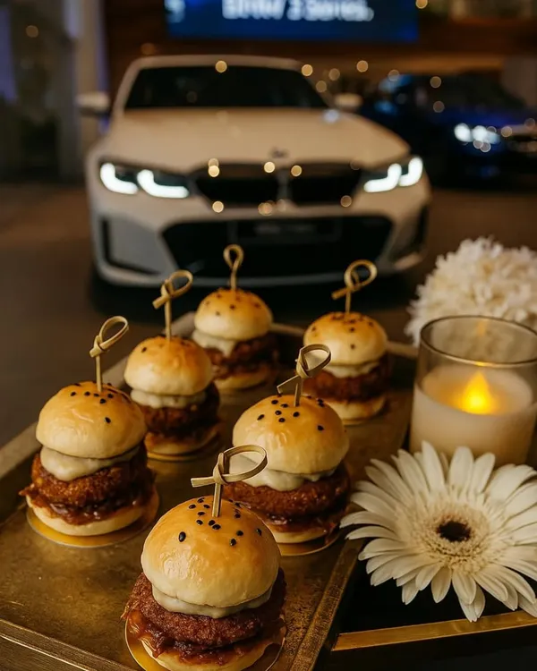 Our gourmet mini sliders are a perfect example of classic comfort food elevated for a luxury event. Served on a golden tray at the BMW 2 Series launch, they were both delicious and visually appealing.